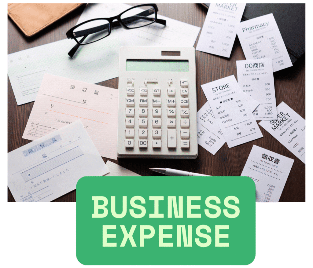 Business expense calculator surrounded by receipts